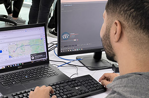 A man tracking freight on his computer