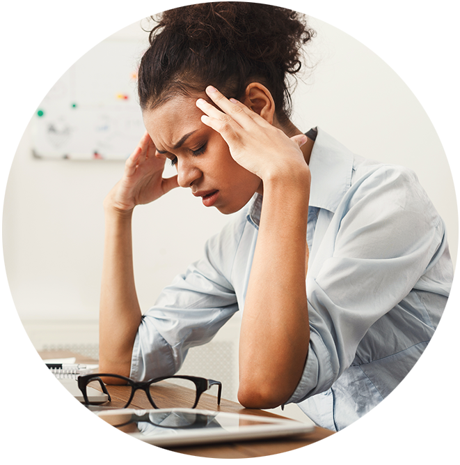 stressed woman with headache at office