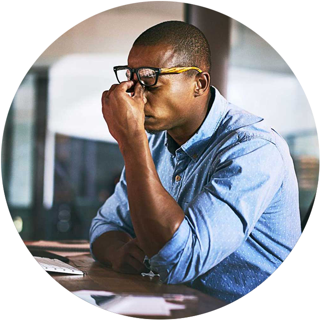 A wine distributor sitting at his desk, his frustration with sourcing alcohol warehousing evident