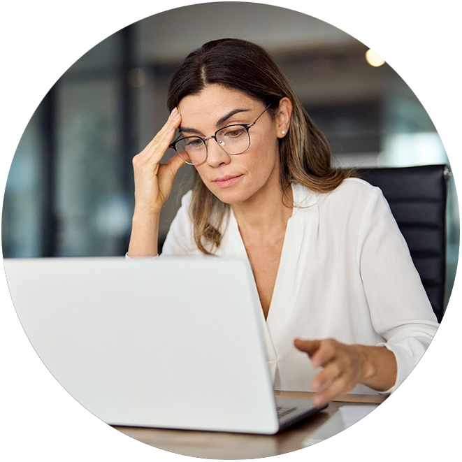 A frustrated shipping manager sitting at her computer as she deals with the complexity of wine logistics